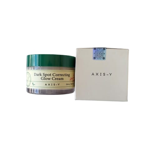 Axis-Y dark spot correcting glow cream jar with packaging on a white background